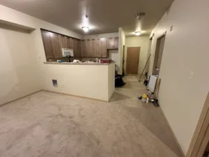condo unit showing new tile paint trim and carpet and cabinets