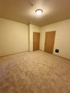 condo unit showing new paint trim and carpet