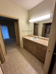 condo unit showing new tile paint trim and carpet and cabinets