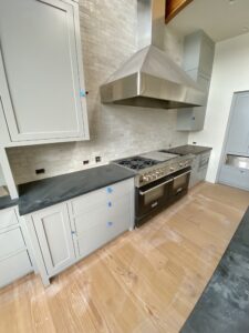 engineered plank fir flooring over radiant heat in a high end kitchen